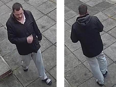 Person 1  12.40pm  man walking in the area of Belfield  white male, dark hair, dark coloured facial hair, wearing a dark jacket, grey sweats, socks and sliders.