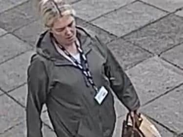 Person 3  1.23pm  woman walking in the area of Belfield white female, blonde hair which may be tied up at the back, wearing a dark green/grey jacket with hood, blue jeans and blue type pumps with white soles. She is carrying a brown coloured handbag in her left hand and has a black lanyard with white writing around her neck.