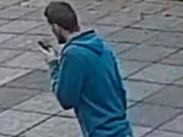 Person 4  1.38pm  man walking in the area of Belfield. White male, dark hair and beard, blue hooded jacket, grey jogging bottoms, wearing sliders and socks. Phone in left hand.