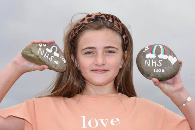 Lyla Andrews with her painted stones