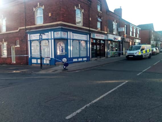 Police tape at the junction of Wigan Lane and Clifton Street