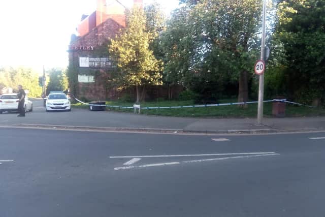 An area at the junction of Wigan Lane and Swinley Road is taped off by police