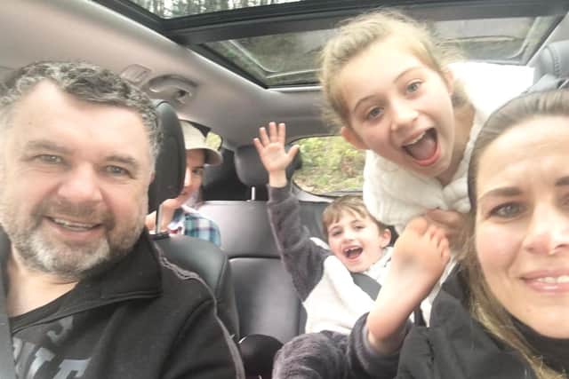 Bishop Steven Evans on a delivery with his family and a church volunteer