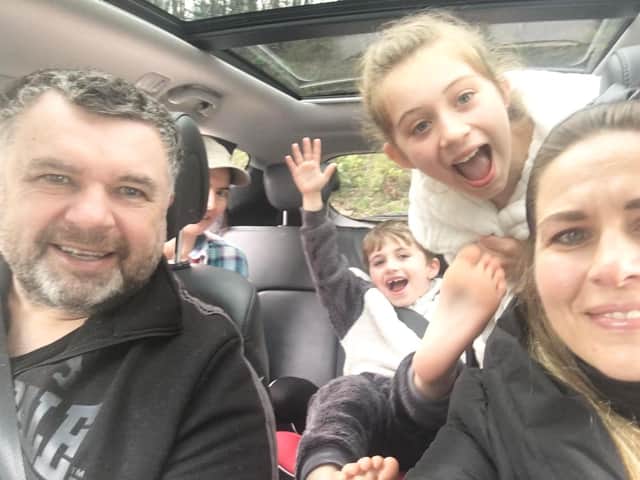 Bishop Steven Evans on a delivery with his family and a church volunteer