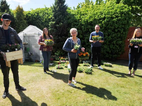 Service users and staff in the garden area