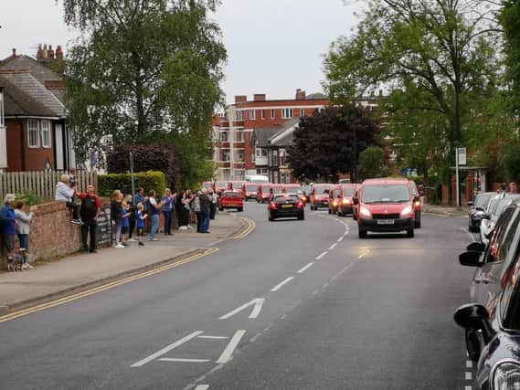 Royal Mail workers drive through Wigan as residents applaud them