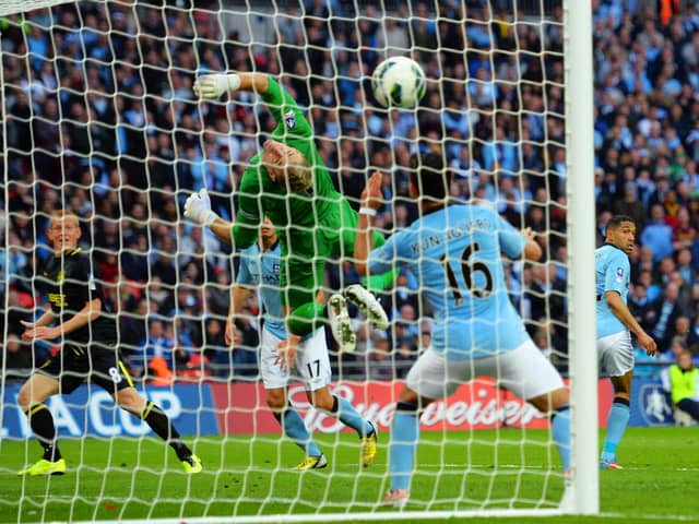 Ben Watson heads home Shaun  Maloney's corner to give Latics the cup