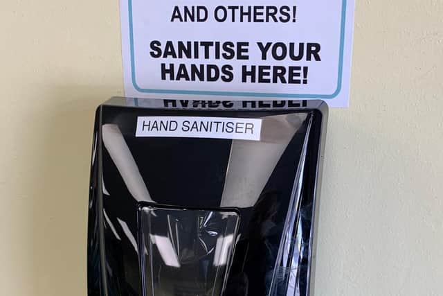 Hand sanitiser station in a Galloways store