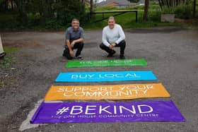 Councillors Chris Ready and Ron Conway with the banners