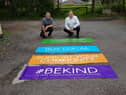 Councillors Chris Ready and Ron Conway with the banners