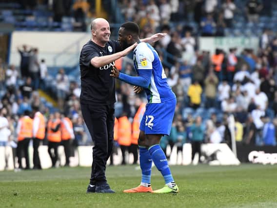 Chey Dunkley celebrating victory at Leeds United with Paul Cook