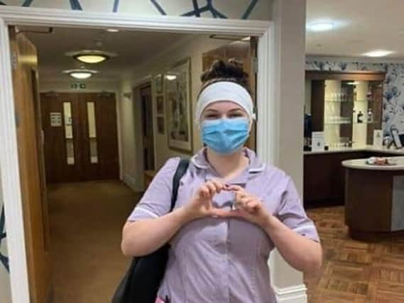 Health worker shows off their headband