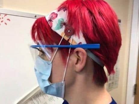 Health worker shows off their headband
