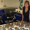 Julie Langan in her workshop at Cedar Farms Galleries, Mawdesley. Julie has raised thousands for Wigan charity The Brick through selling glass rainbows and hearts