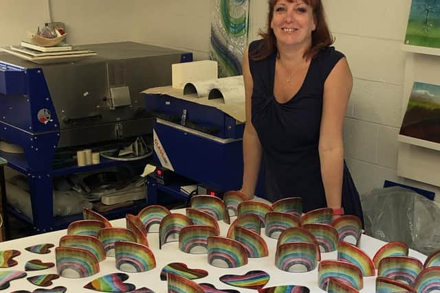 Julie Langan in her workshop at Cedar Farms Galleries, Mawdesley. Julie has raised thousands for Wigan charity The Brick through selling glass rainbows and hearts