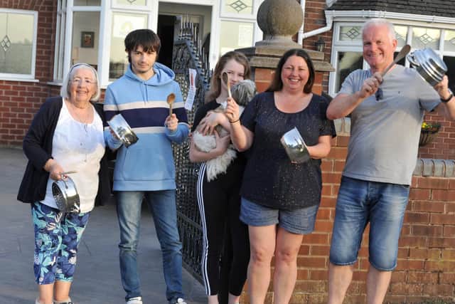 Residents of Pemberton Road, Winstanley, Wigan, come out of their homes to clap for carers on Thursday night. Pemberton Road has just been named thhe Friendliest Street in Britain 2020.