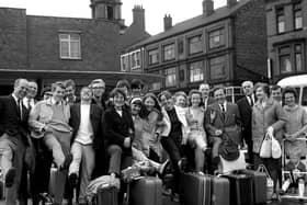 All smiles as Wiganers get ready to board coaches to the seaside during the annual wakes weeks holiday July 1969