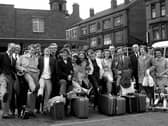 All smiles as Wiganers get ready to board coaches to the seaside during the annual wakes weeks holiday July 1969