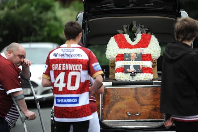 Graham's funeral procession prepares to leave Sullivan Way