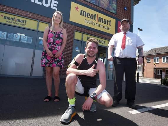 Lee pictured with colleagues Helen Downs, left, and Gavin Dickens store manager at Wigan Meat Mart