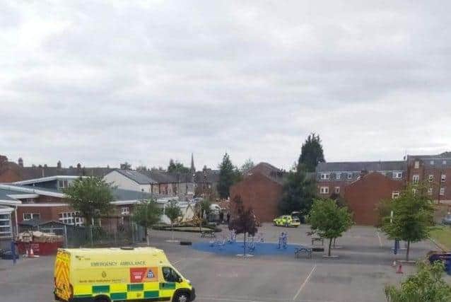 Police and paramedics on the school grounds following the incident