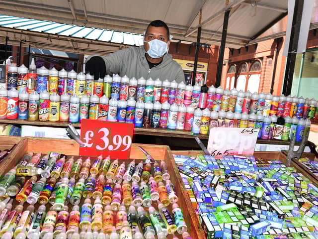 Stallholder Dherminder Singh back at work on Wigan's outdoor market