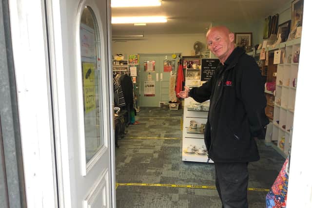 Michael Evans prepares to welcome people back to The Brick's shop