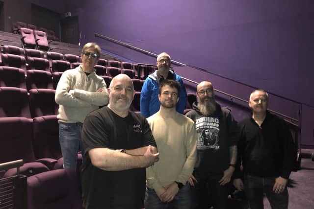 Leigh Film Society volunteers picking up the seats for the cinema