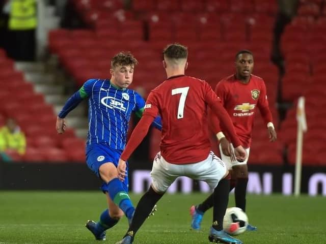 Alfie Devine playing for Latics Under-18s against Manchester United