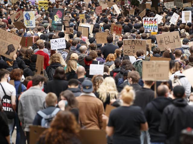 Demonstrators pack into Manchester city centre