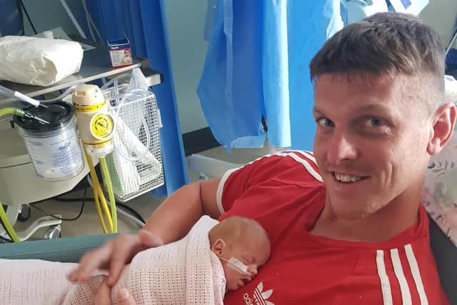 Paul Roe in hospital with baby Betsy