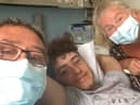 Joshua Whittle in hospital with his parents Jason and Melony