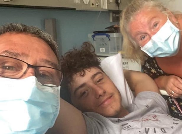 Joshua Whittle in hospital with his parents Jason and Melony