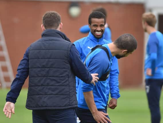 Nathan Byrne shares a joke at training with Sam Morsy and Anthony Barry