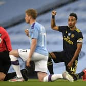 Players and officials take the knee ahead of Manchester City's Premier League clash with Arsenal in midweek