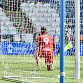 Jamal Lowe celebrates opening the scoring for Wigan