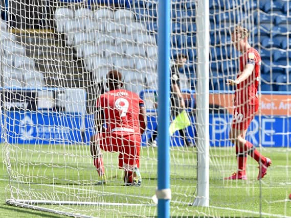 Jamal Lowe celebrates opening the scoring for Wigan