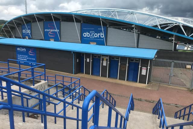 The away end before kick-off at the John Smith's Stadium. Fans would normally be streaming through the turnstiles