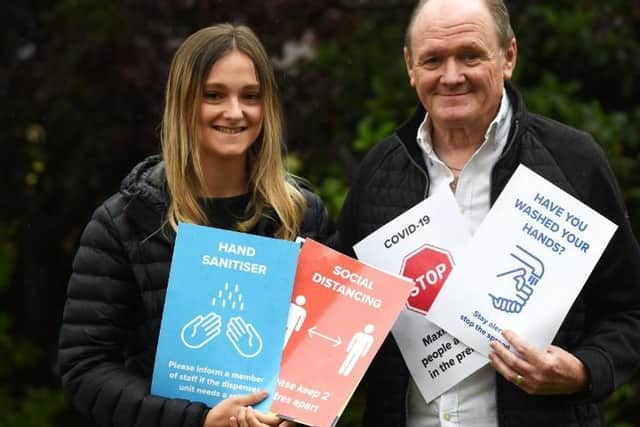 Fiona Hutchings with dad, Barry Hutchings, from Scene Print and Design, who are offering free signage for businesses to help them during the coronavirus pandemic.