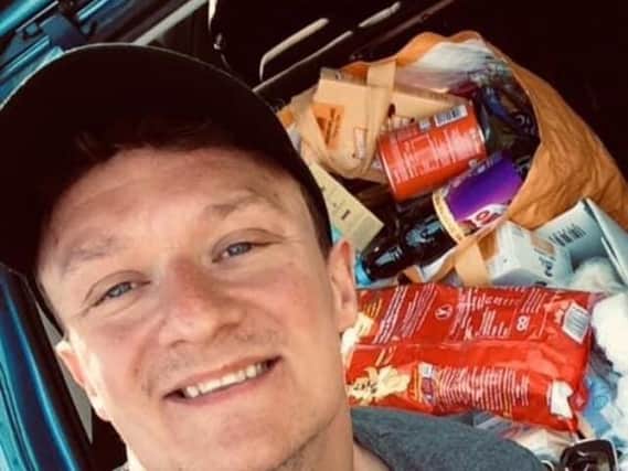 Danny Fletcher with the weekly food donations