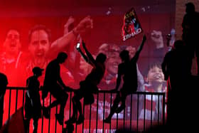 Liverpool fans celebrating outside Anfield, Liverpool, after the club won the Premier League.