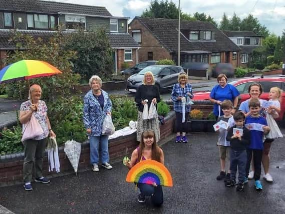 Some of the residents in Willowbrook Drive, Shevington, with their frontline kits