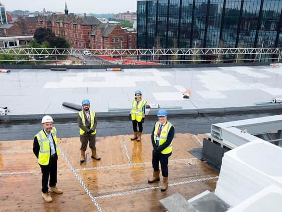 Celebrating on top of the Student Centre