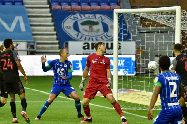 Kai Naismith gets ready to help the ball over the line after Jamal Lowe's cross shot is palmed onto crossbar by Stoke's goalkeeper Jack Butland