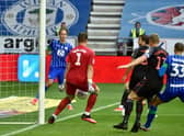 Kieran Dowell's shot deflects off Jack Butland for Wigan's opening goal