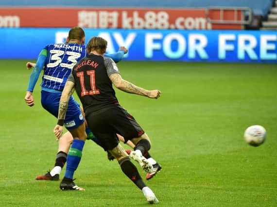 Kal Naismith rifles home his second and Wigan's third goal against Stoke