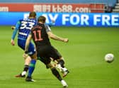 Kal Naismith rifles home his second and Wigan's third goal against Stoke