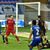 Kal Naismith stabs home his first and Wigan's second goal against Stoke