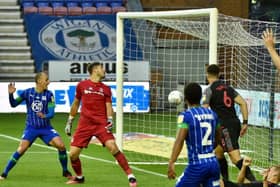 Kal Naismith stabs home his first and Wigan's second goal against Stoke