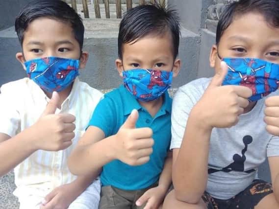 Children wear face protectors as part of the project